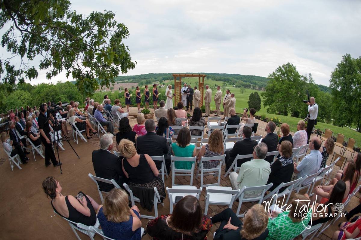 Guests seated for a hilltop ceremony
