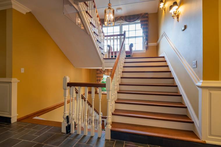 The main stairwell of the Estate House, beneath its two-storey chandelier