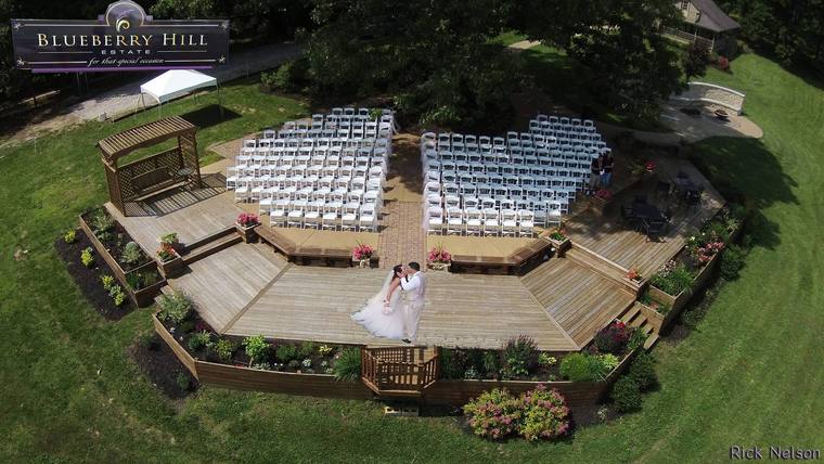 The hilltop ceremony deck seen from above, chairs set in rows either side of the aisle