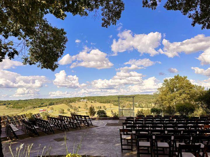 Chairs set out for a ceremony under a wide open sky